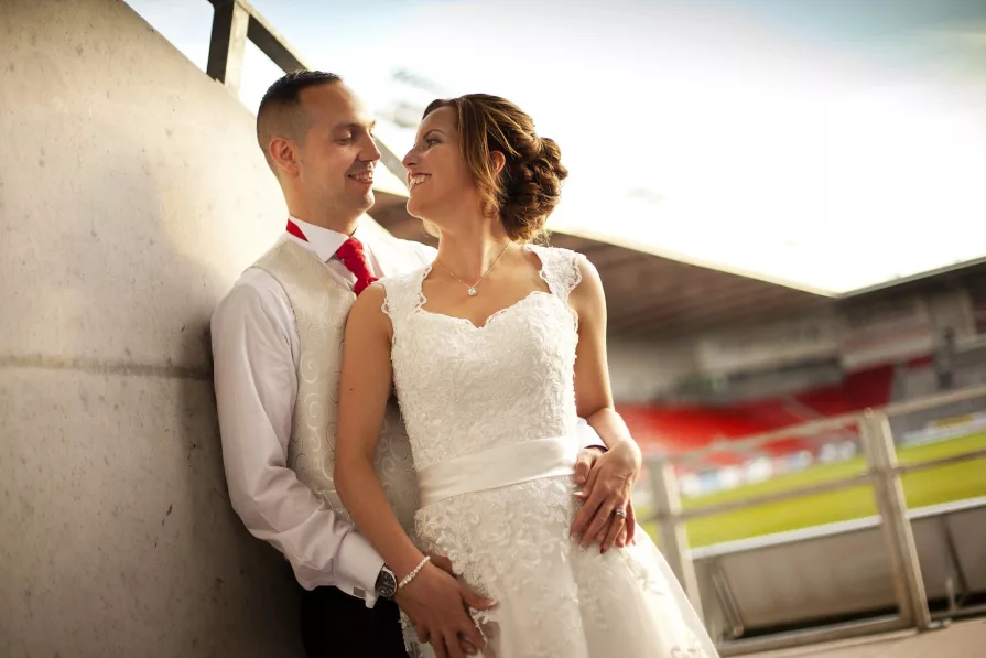 bride and groom looking into each others eyes
