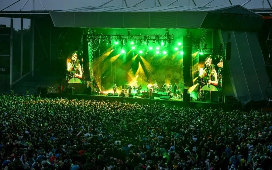 crowd with stage on green lights