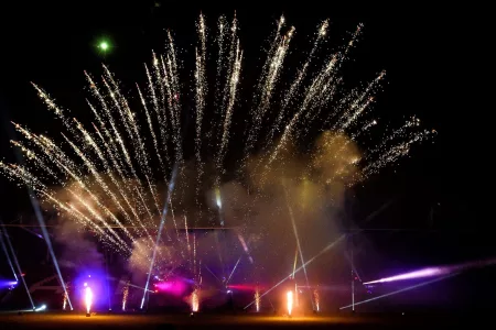 firework display with spotlights beaming underneath
