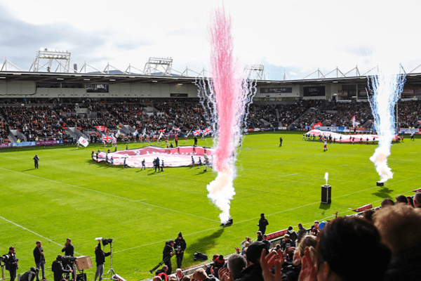 start of rugby event with smoke going off