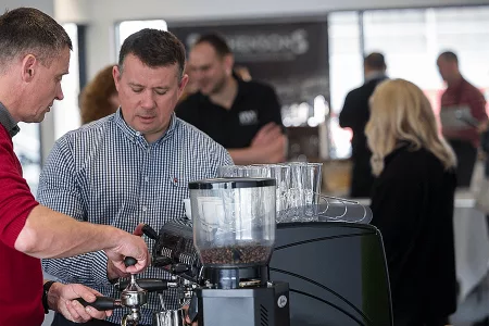 two men making coffee