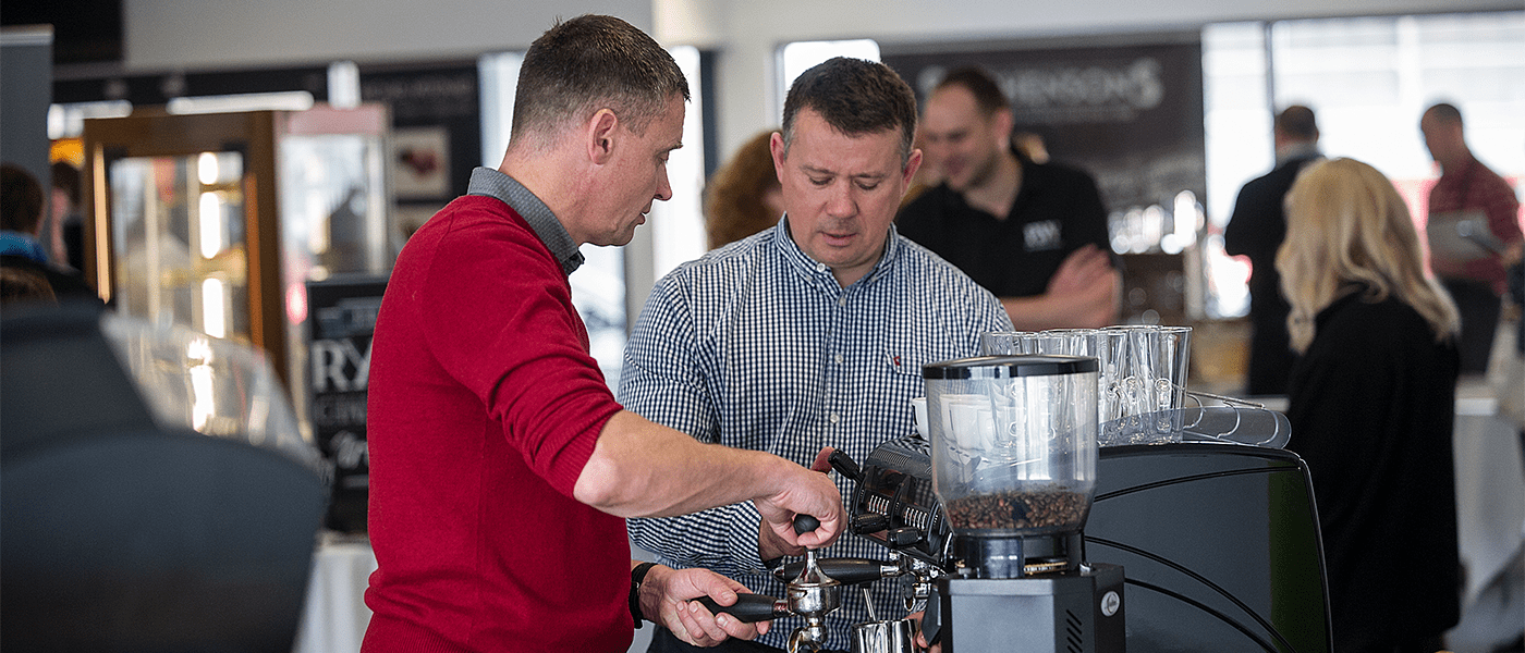 two men making coffee