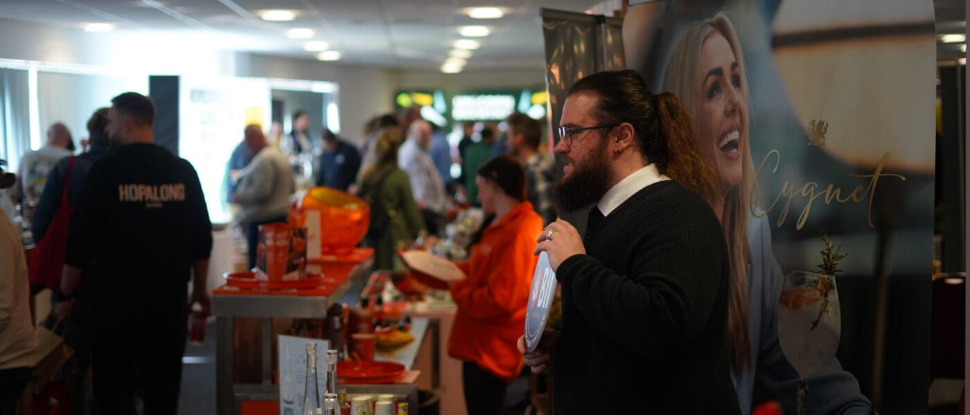 long haired and bearded man at expo