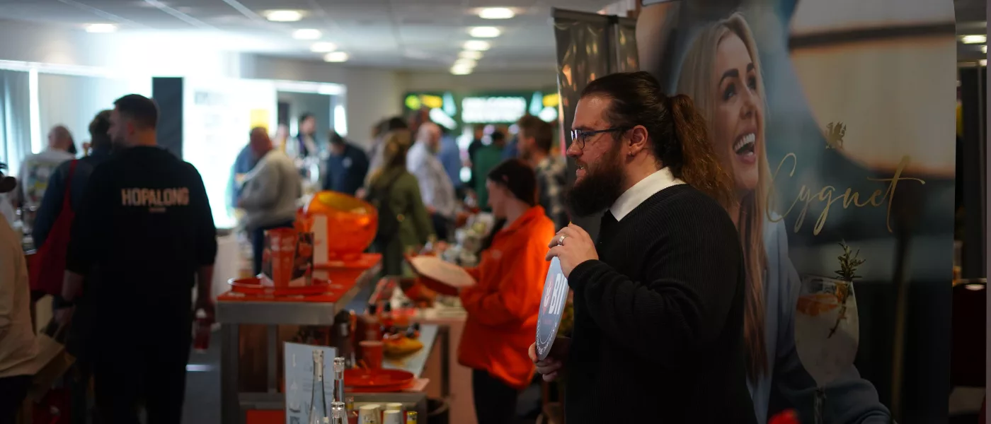 long haired and bearded man at expo