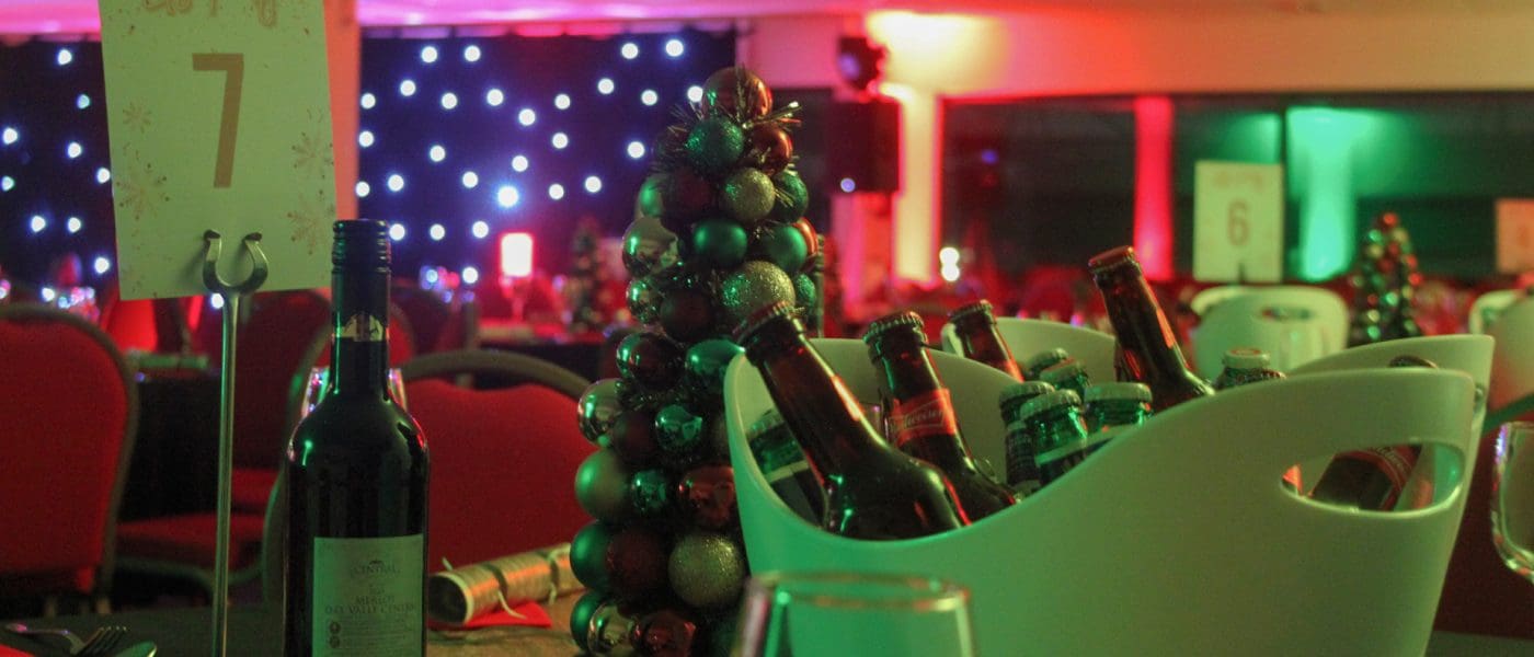 bucket of beer with bauble tree behind